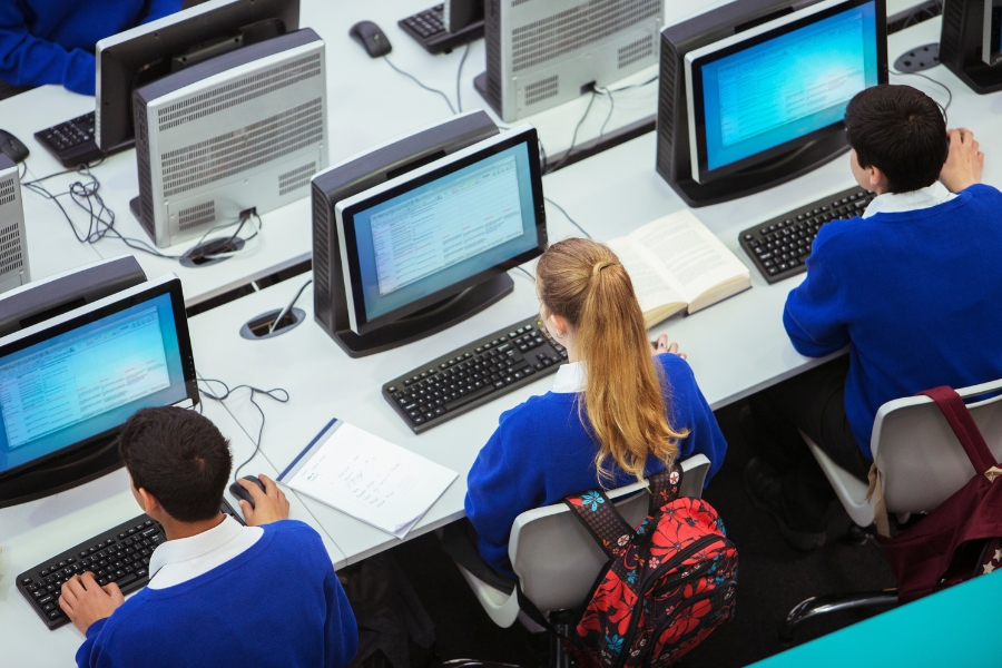 children in school on computers